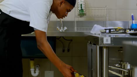 chef putting tray of cookies in oven 4k