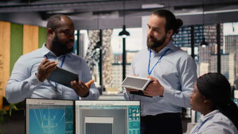 engineers in office brainstorming upgrades for innovative solar powered device