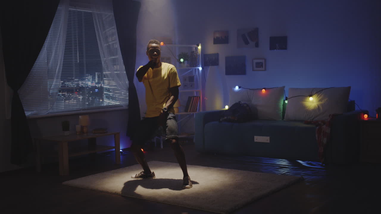 Teenager Dancing in His Bedroom at Night