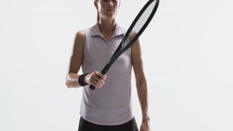 young caucasian woman holds a tennis racket