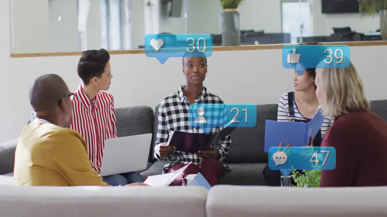 In office, diverse group discussing animation metrics for social media engagement
