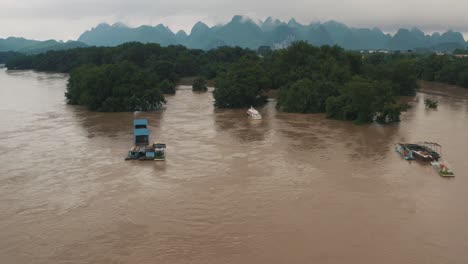 fisherman boats in flooded river in china, li jiang in guilin, drone view