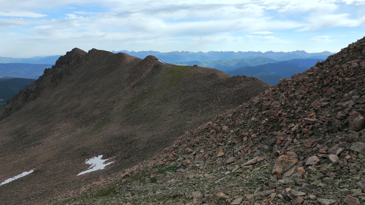 Morning Halo Ridge Notch Mountain Shelter Gore Range Vail Minturn Redcliff aerial drone Colorado sunny blue sky summer Mount Holy Cross 14er peak Wilderness Sawatch Range Rocky Mountains snow forward