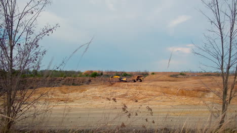 tracked excavator in quarry. excavator working on earthmoving at quarry