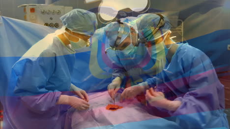 animation of flag of ecuador waving over surgeons in operating theatre