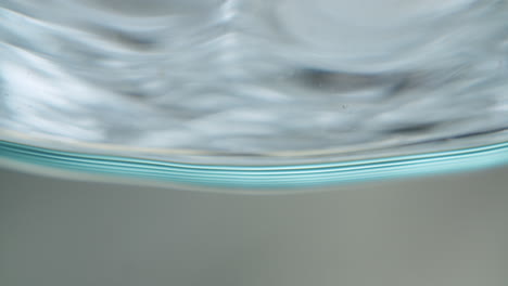 mesmerizing abstract shot of water getting filled into a glass