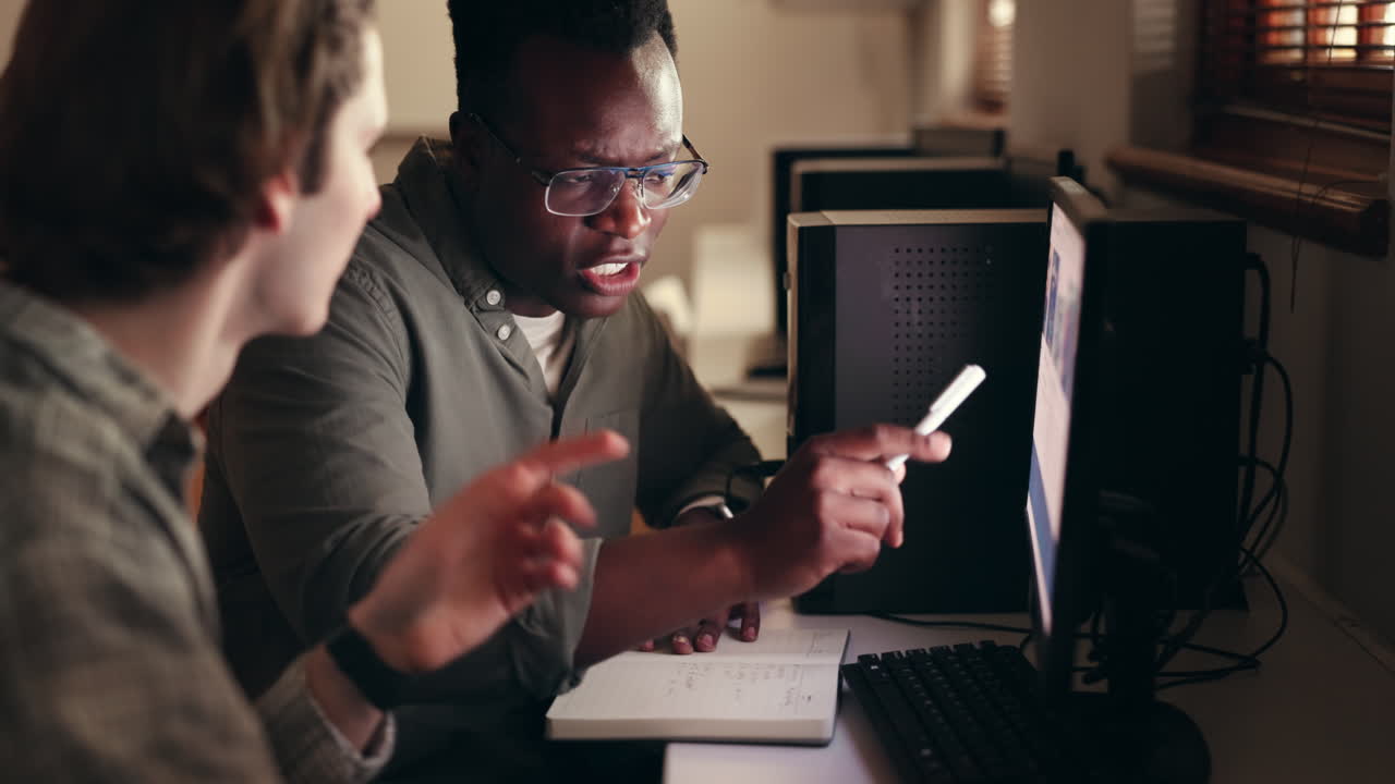 Young men, teamwork and computer for information