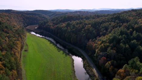 aerial-tilt-down-the-new-river-in-ashe-county-nc,-north-carolina-near-jefferson-and-west-jefferson-nc,-north-carolina