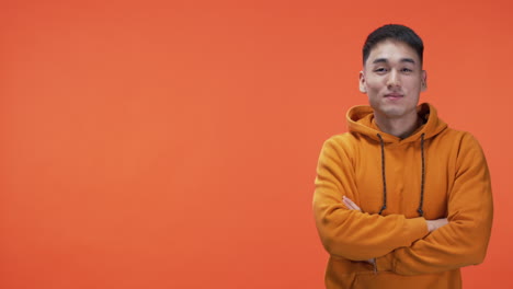 man in orange hoodie