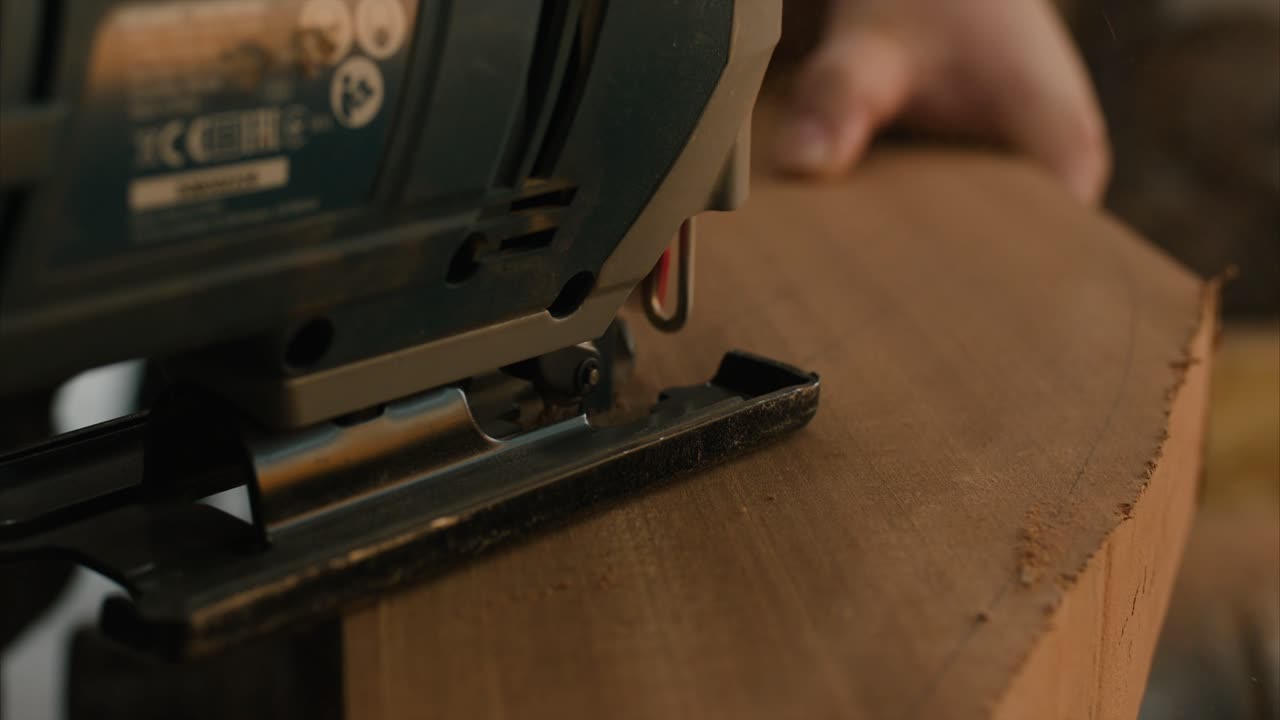 Sawing light wood with a jig saw in slow motion