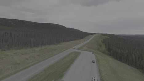 an rv drives along the remote and scenic alaska highway