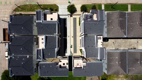 An-Ascending-Aerial-View-of-Condos-and-Multi-Units,-on-a-Sunny-Day