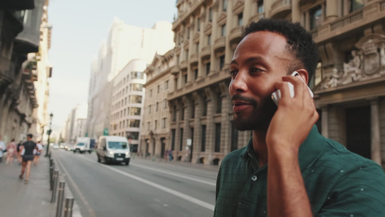 Man Talking on Phone on City Street