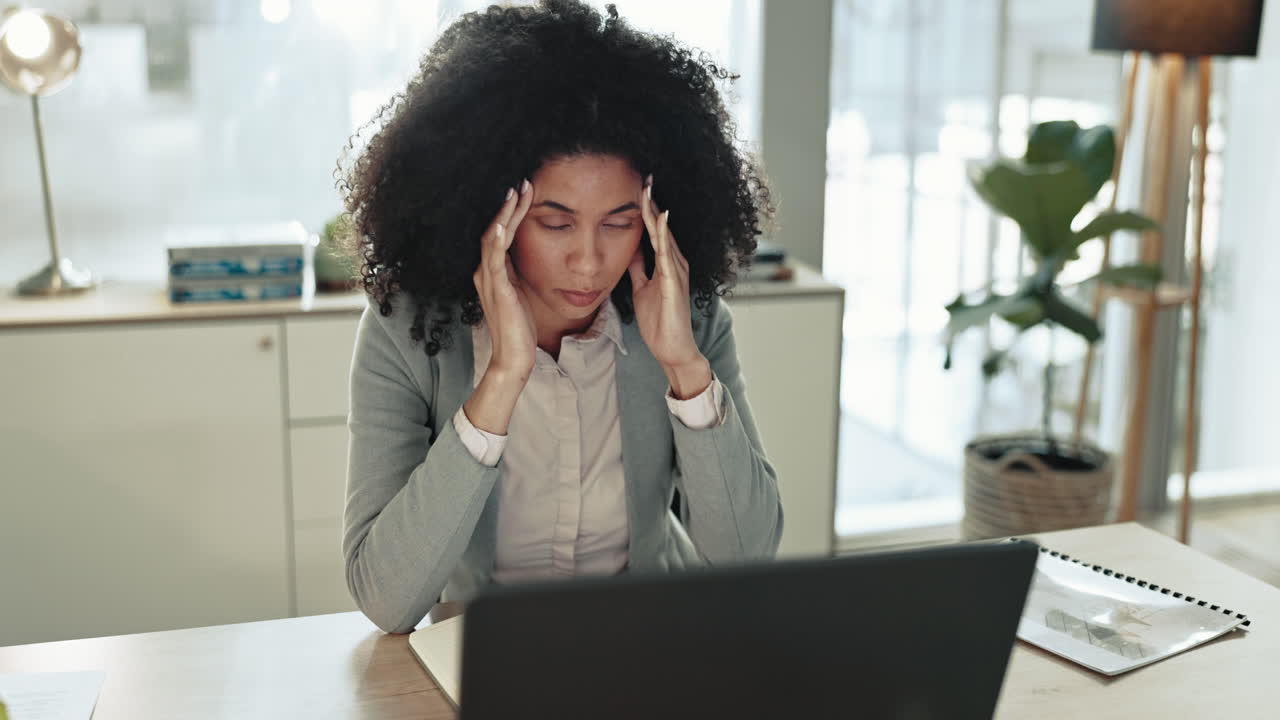 Business woman, tired and headache at laptop
