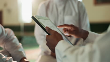 muslims using a tablet for studying
