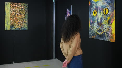 woman viewing art in an exhibition