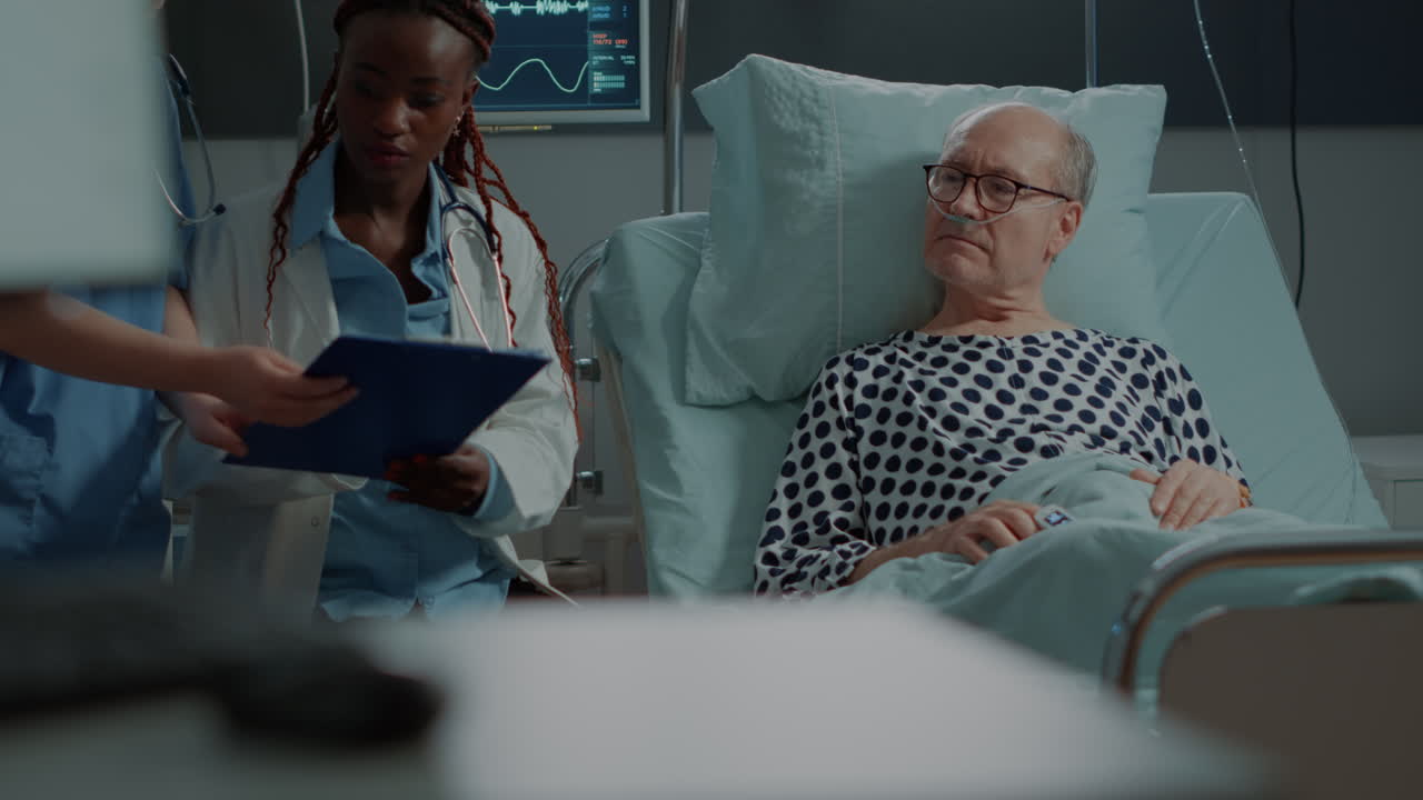 Multi ethnic medical staff explaining disease to patient