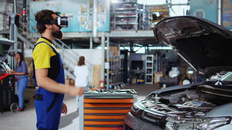 Car-technician-using-virtual-reality