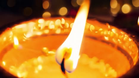 close-up of a lit candle during a diwali celebration