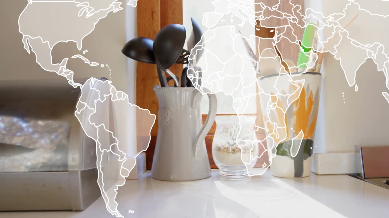 Translucent world map appearing and shifting across kitchen counter showing global connection