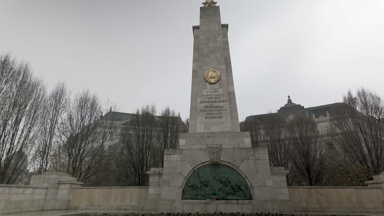 Low angle POV approaches Soviet War Memorial, Liberty Square Budapest