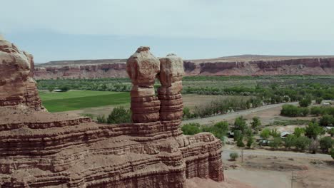 navajo twins rock formation in southwest desert town of bluff, utah, aerial