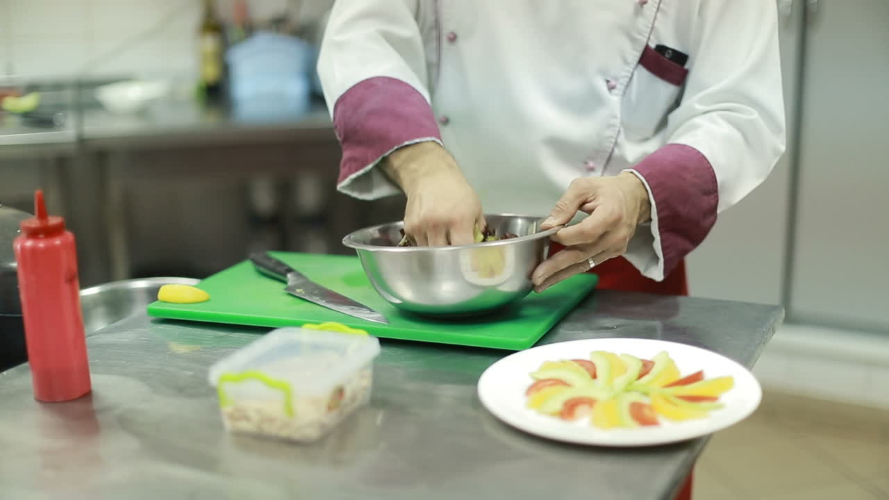 Chef Cooking Vegetable Salad. Chef cook making vegetarian salad on the kitchen