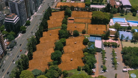 aerial - tennis courts at club ciudad de buenos aires, argentina, approach tilt down