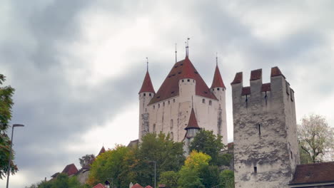 thun castle schlossberg swiss alps switzerland historic site cloudy morning beauty landscape summer fall autumn greenery city bern interlocken aare thunersee slow cinematic pan down