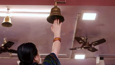 devotee-ringing-the-holly-bell-at-temple-at-morning