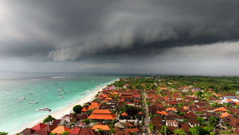 storm clouds in the distance from nusa lembongan island in bali, indonesia