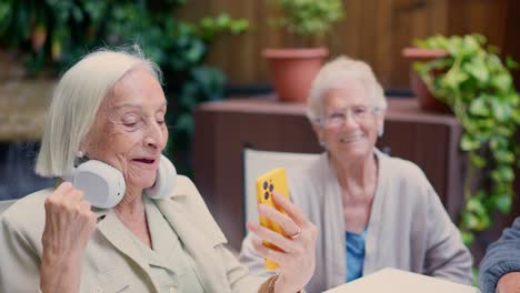 Elderly people using technology outdoors