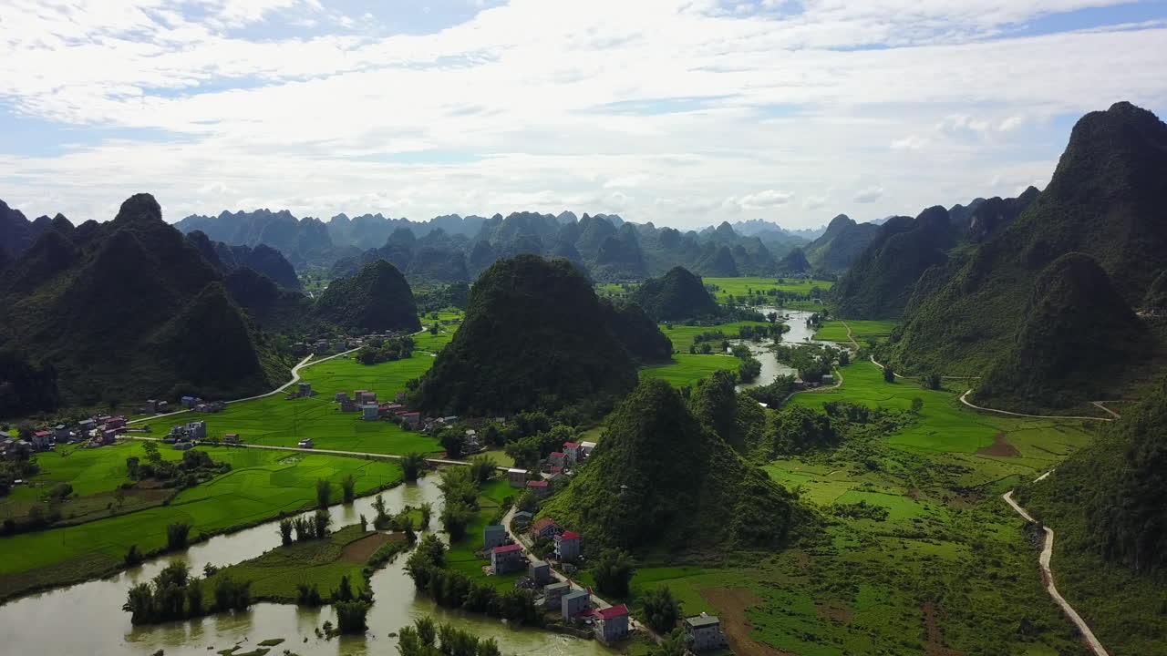 Serene aerial view of Ban Gioc Waterfalls and lush green landscape