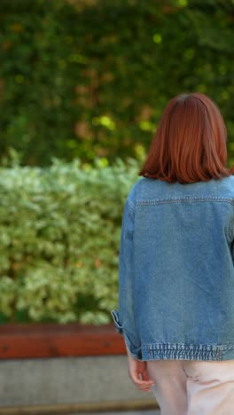 woman walking in a park