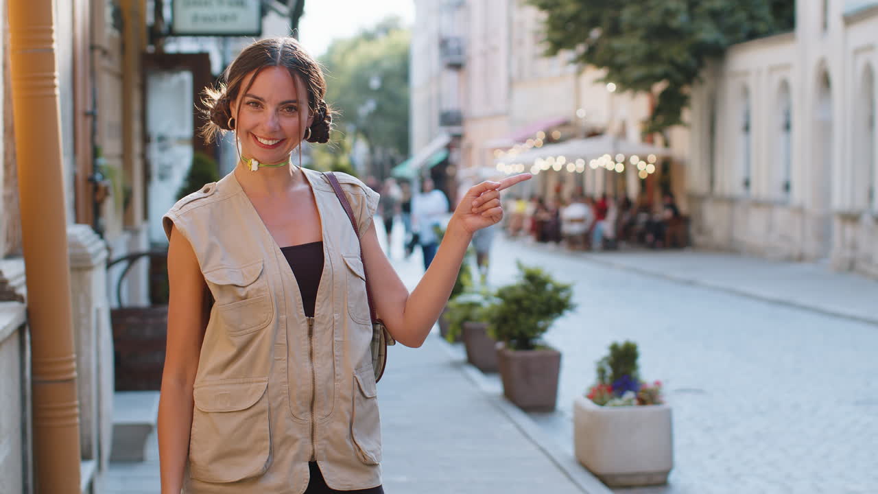 Thoughtful woman pointing empty place advertising area for commercial text copyspace in city street