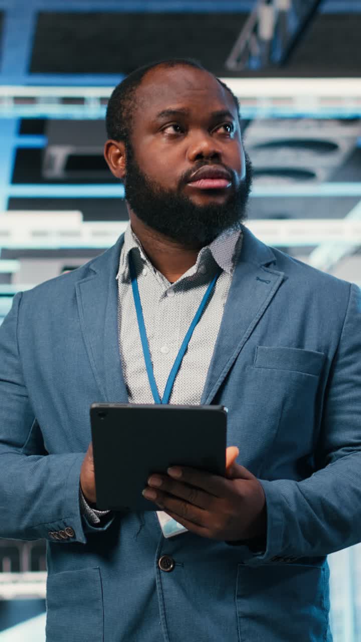 Vertical video Doing network management, laptop and software developer in server farm