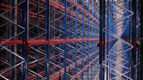 big and modern warehouse under construction, featuring metal shelving and other industrial equipment.