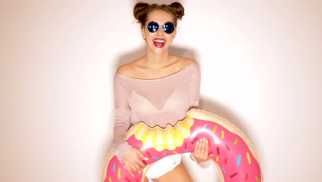 woman with donut inflatable