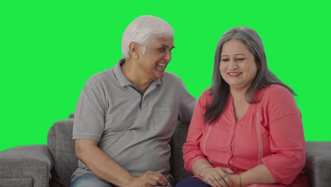 Happy-Indian-old-couple-talking-to-each-other-Green-screen