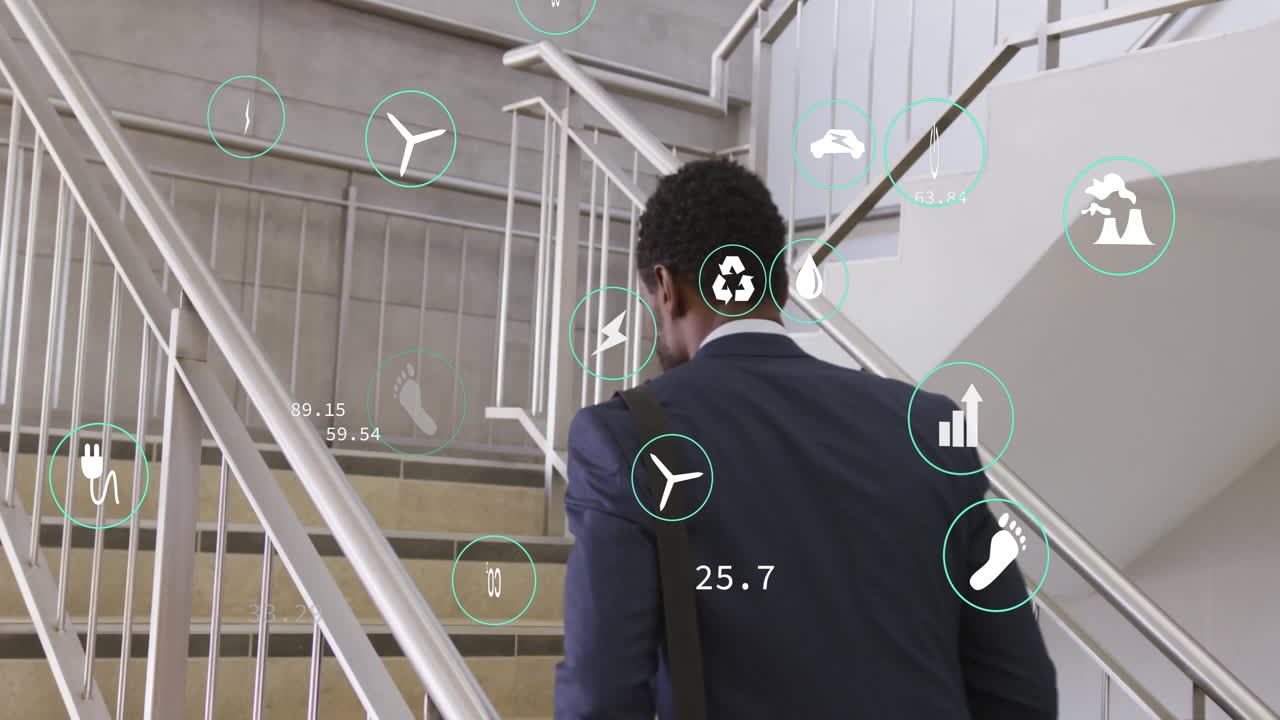 animación de iconos de ecología y procesamiento de datos sobre empresario biracial caminando en la oficina