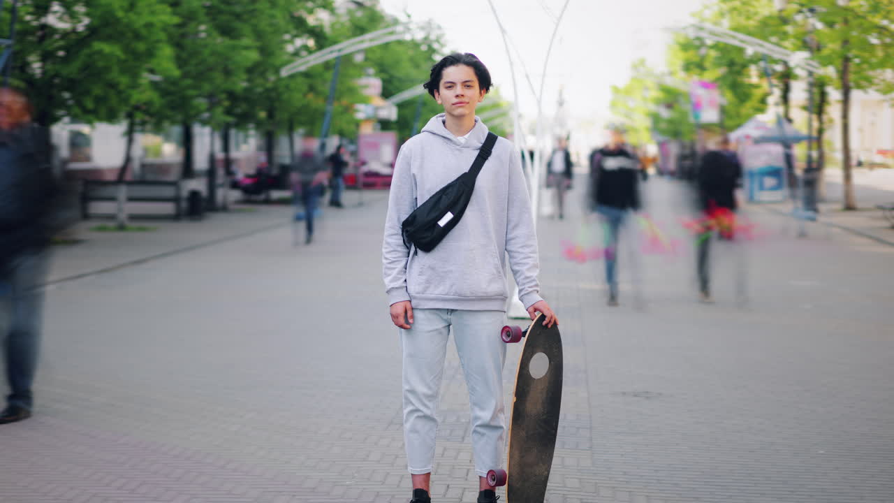 Teenager with Skateboard in City