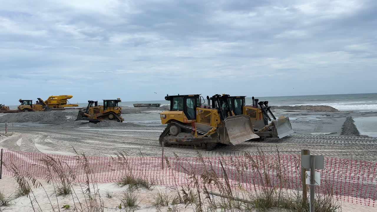 Bulldozers Working on Beach Construction Project