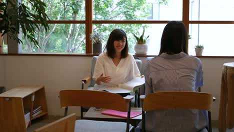 young professionals talking at coworking cafe