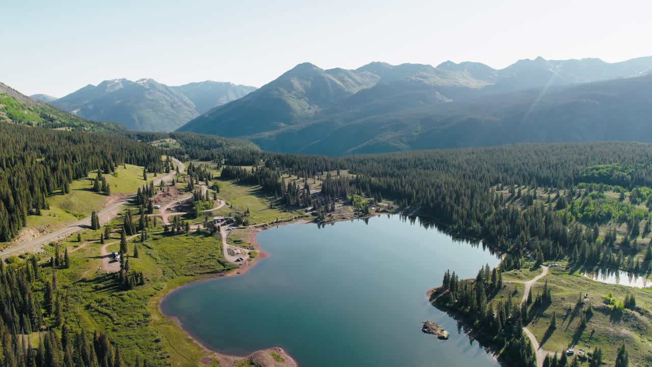 Aerial push in shot featuring the landscape in the San Juan mountains.
