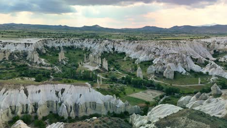 aerial view of stunning rocky landscape in cappadocia, turkey during sunset