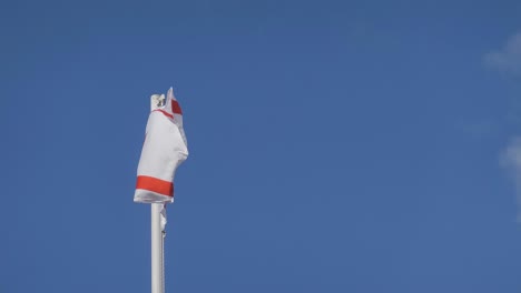 flag of turkish northern cyprus waving in wind, copy space on right