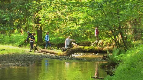 a family and their dog cross a small body of water