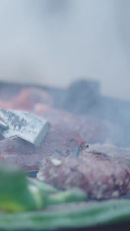 close-up of food grilling on a barbecue with smoke