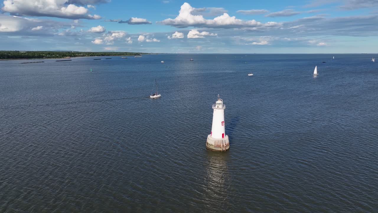 Aerial view of Raritan Bay with Great Beds Lighthouse and sailboats