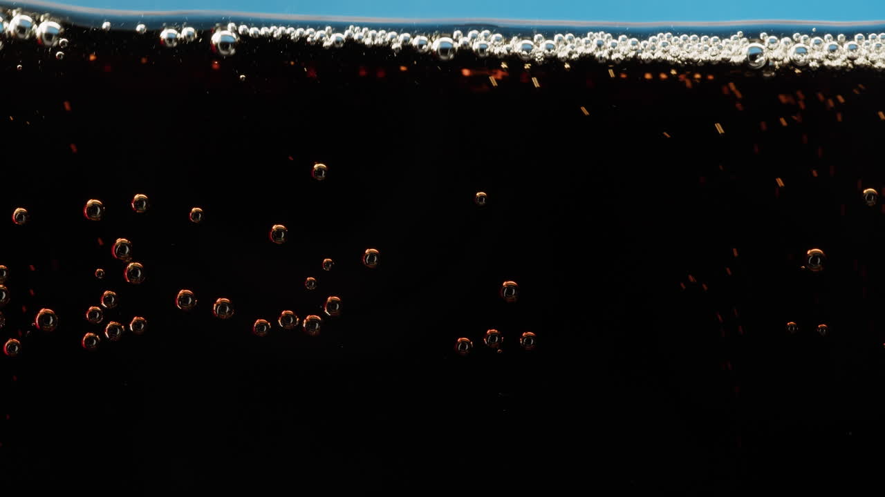 Close-up of soda bubbles and foam